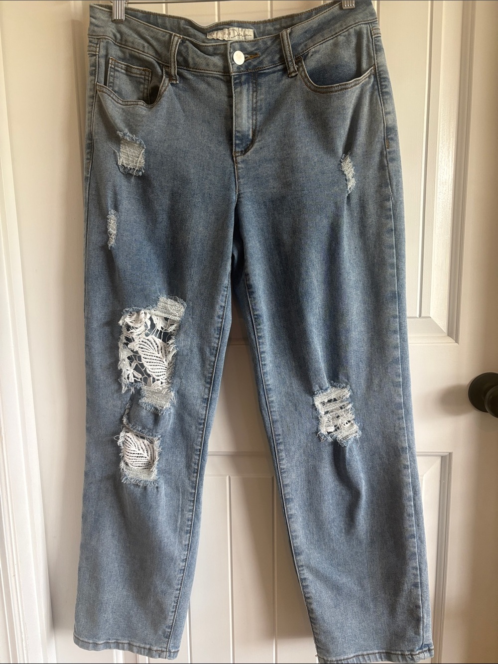 Light Blue Distressed Boyfriend Jeans - Relaxed Fit  mid to hi-rise .